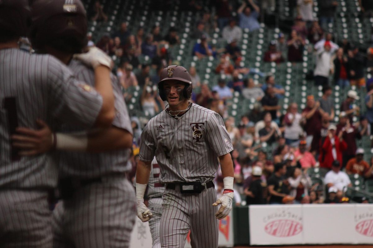 Texas State sophomore infielder Chase Mora (2) runs up to his team after making a grand slam,  March 2, 2024, Minute Maid Park.