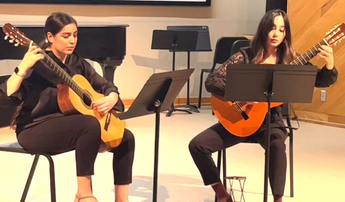 Texas State students Marina De la Cruz (Left) and Sophie Reel (Right) rehearse, Nov. 20, 2023, in the Music Building.