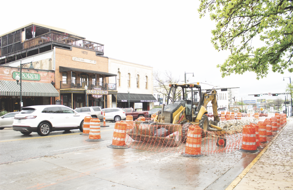 Cars navigate through the construction at the intersection of Hopkins and Guadalupe, Sunday, March 17, 2024, in downtown San Marcos. 