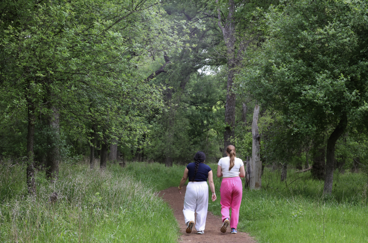 Local residents take a stroll through Purgatory Creek Park, Wednesday, March 20, 2024, in San Marcos.