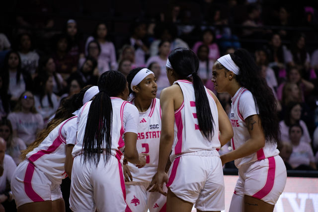 The Texas State womens basketball huddles up during the game against Marshall Wednesday, Feb. 21, 2024, at Strahan Arena.