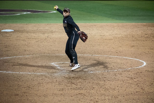 Texas State senior right-hand pitcher Jessica Mullins (4) prepares to throw the ball during the game against Texs, Wednesday, Feb. 28, 2024, at Bobcat Softball Stadium.
