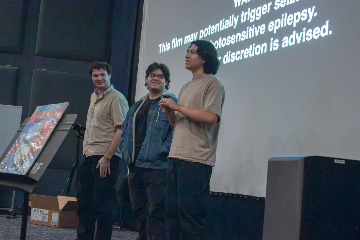 Nate Wilburn (left), Justyce Padilla (center) and Sebastian Saavedra (right) offer a brief at the screening for Crabs in a Bucket as students pile in attendance, Friday, March 1, 2024, at the Department of Theatre and Dance.