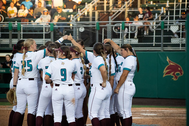 The Texas State softball team huddles together during the game against Baylor, Wednesday, April 3, 2024, at Texas State Softball Stadium.