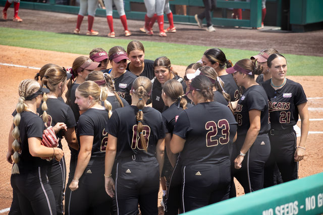 The Texas State softball team gathers during a break at the game against Louisiana-Lafayette, Saturday, April 13, 2024, at Bobcat Softball Stadium.