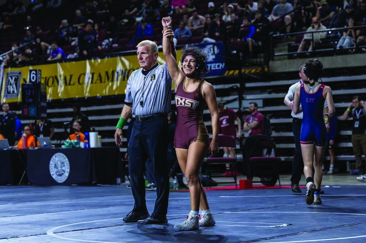 Sophomore Jasmine Cortez gets her hand raised after a match at the National Collegiate Wrestling Championship, Saturday, March 18 , 2024, in Shreveport, LA 
