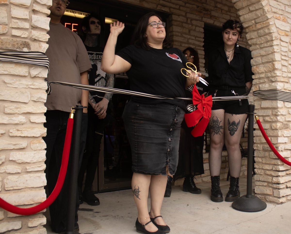 Triple Six Social owner Andrea Hernandez cuts the ribbon during its grand opening, Friday, April 19, 2024, at 329 Cheatham St. in San Marcos.