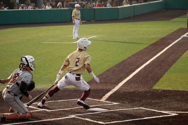Texas State sophomore second baseman Chase Mora (2) drops his bat to run to first baseball after successfully hitting the ball against Texas, Tuesday, April 9, 2024, at Bobcat Ballpark.