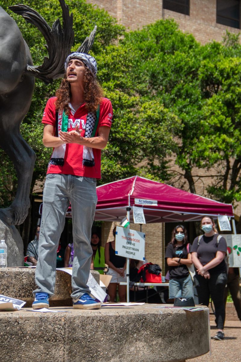 Zachariah Al-Natoor, a Palestinian man and geography student, gestures with his hands to emphasize his speech for the sit-in for Palestine on The Quad on Monday, April 29, 2024. 