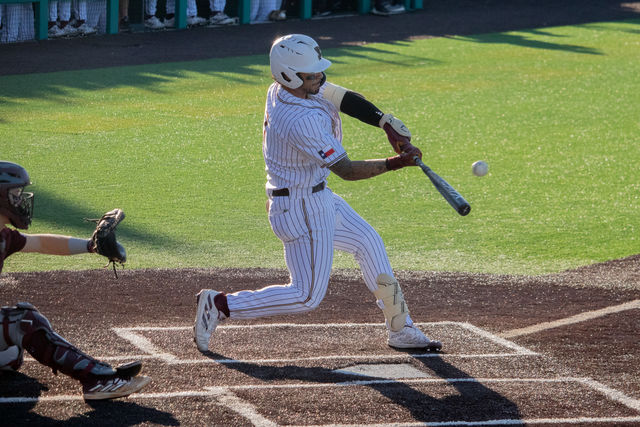 Texas State junior left fielder Daylan Pena (7) hits the ball in the game against Texas A&M, Tuesday, April 4, 2024, at Bobcat Ballpark.