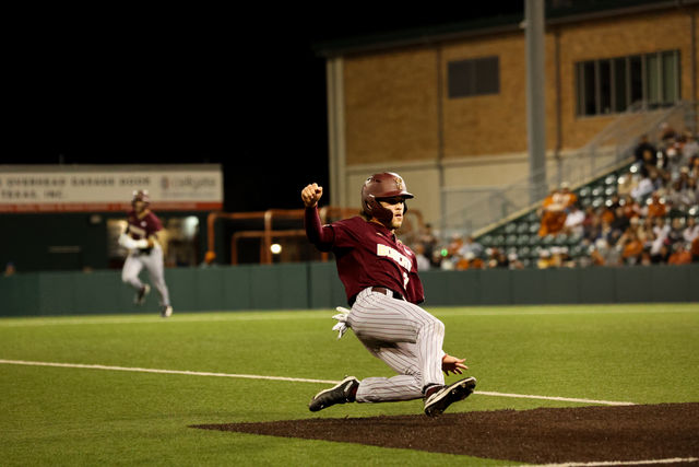 Texas State senior infielder and outfielder Alec Patino (23) goes to slide to third base during the game against Texas, Wednesday, April 10, 2024, at UFCU Disch-Falk Field in Austin.