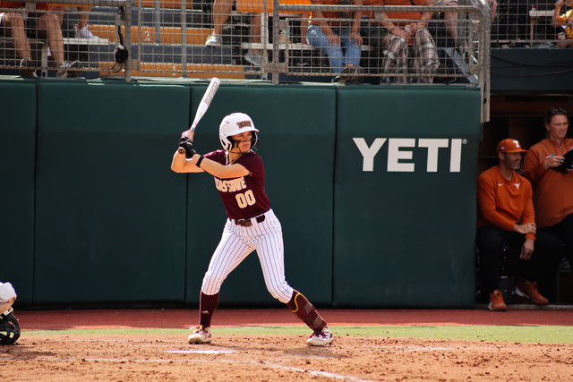 Texas State sophomore catcher Megan Kelnar (00) prepares to swing the bat during the game against Texas, Wednesday, April 10, 2024, at Red and Charline McCombs Field.