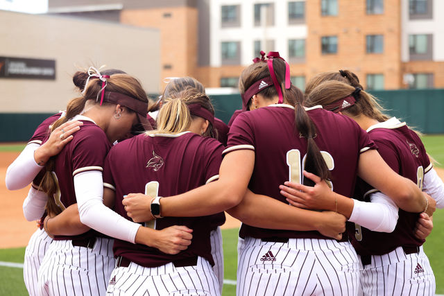 Texas State softball players huddle up before the game against Texas, Wednesday, April 10, 2024, at Red and Charline McCombs Field.