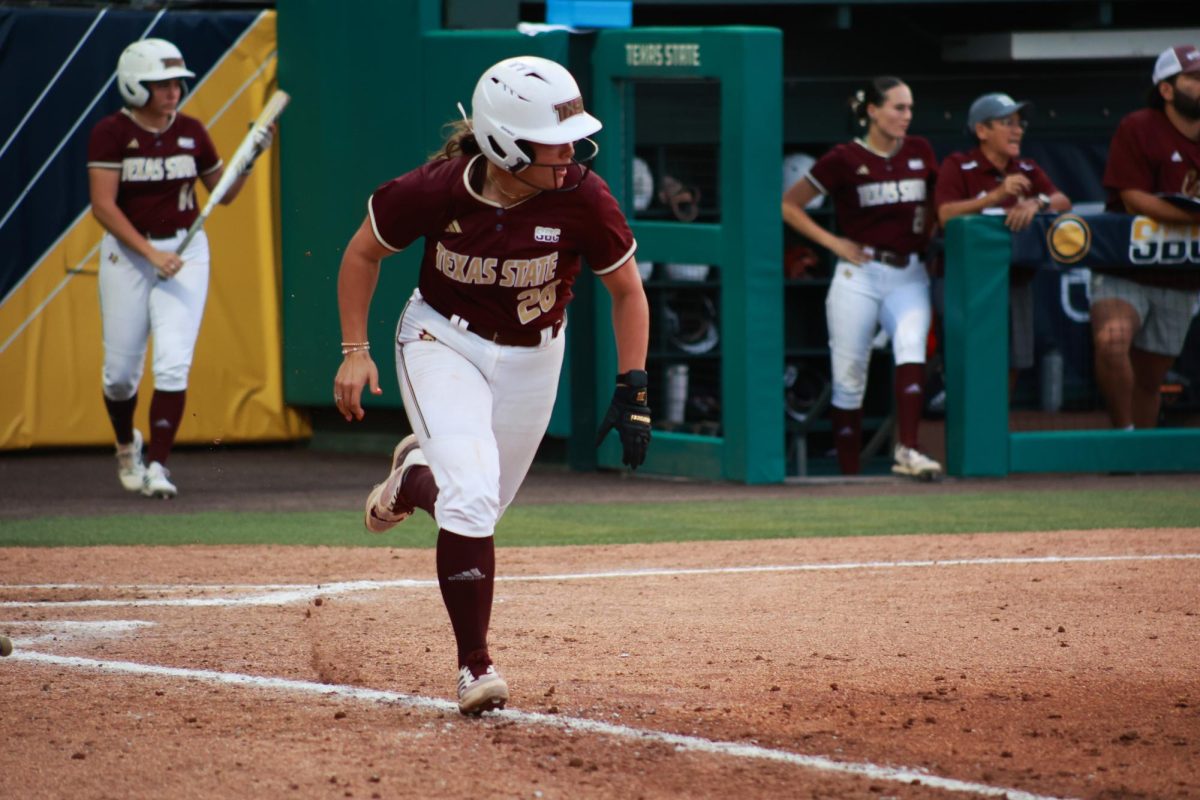 Texas State graduate student infielder Sara Vanderford (26) rushes to first base during the Sun Belt Conference semifinals game against South Alabama, Friday, May 10, 2024 at Texas State Softball Stadium.