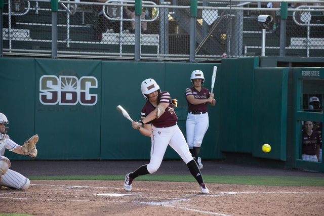 Texas State sophomore utility Katarina Zarate (28) swings her bat to attempt to hit the ball during the game against Penn State, Friday, March 8, 2024, at Bobcat Softball Stadium.