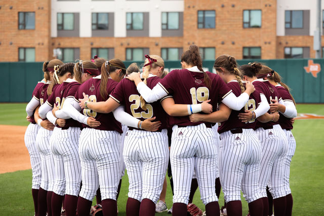 The Texas State softball team huddles up before the game against, Texas, Wednesday, April 10, 2024, at Red and Charline McCombs Field in Austin.