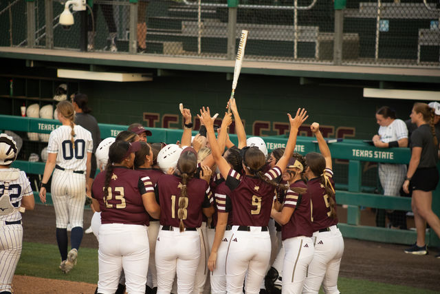 The+Texas+State+softball+team+celebrates+its+second+win+against+Penn+State%2C+Friday%2C+March+8%2C+2024%2C+at+Bobcat+Softball+Stadium.