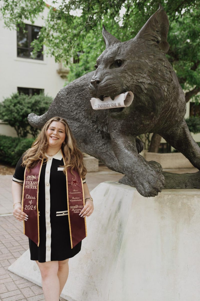 Nichaela Shaheen, managing editor at The University Star, poses in front of the Bobcat statue, Wednesday, April 24, 2024.