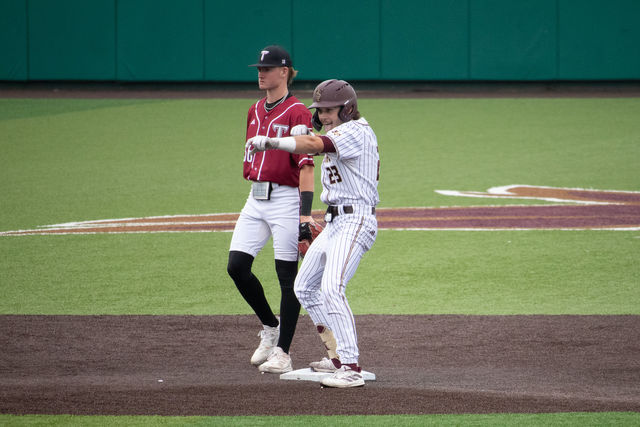 Texas State senior first baseman Alec Patino (23) celebrates at second base after hitting a double during the game against Troy, Saturday, May 11th, 2024, at Bobcat Ballpark.