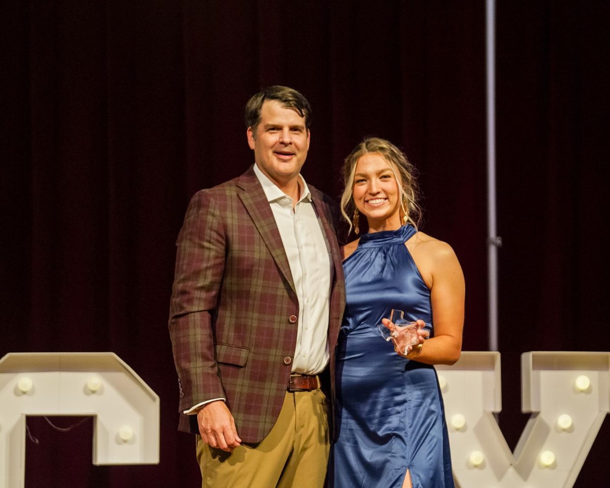 Texas State senior pitcher Jessica Mullins accepts the Texas State Woman Athlete of the Year award from Director of Athletics Don Coryell at the CATSPYS ceremony, Monday, April 29, 2024, at Strahan Arena.
