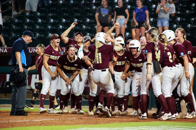 Texas State senior outfielder Piper Randolph (11) meets her teammates at home base to celebrate hitting a home run during the game against Penn State at the NCAA Regionals Tournament, Saturday, May 18, 2024, at Davis Diamond in College Station, Texas.