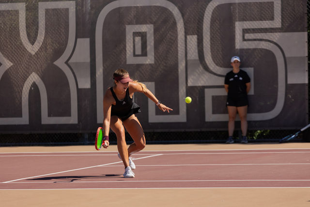 Texas State graduate student Emma Carr hits the ball during the doubles match against Troy, Friday, April 5, 2024, at Bobcat Tennis Complex.