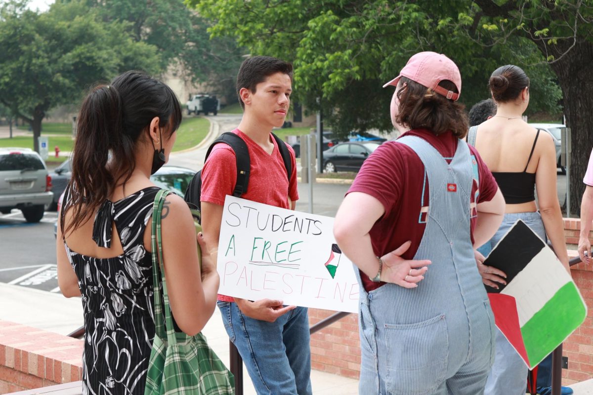 Allen Dominguez, co-chair of YDSA, and other Texas State students gather to deliver a letter to President Kelly Damphousse against Executive Order 44 on Wednesday, May 8, 2024. 