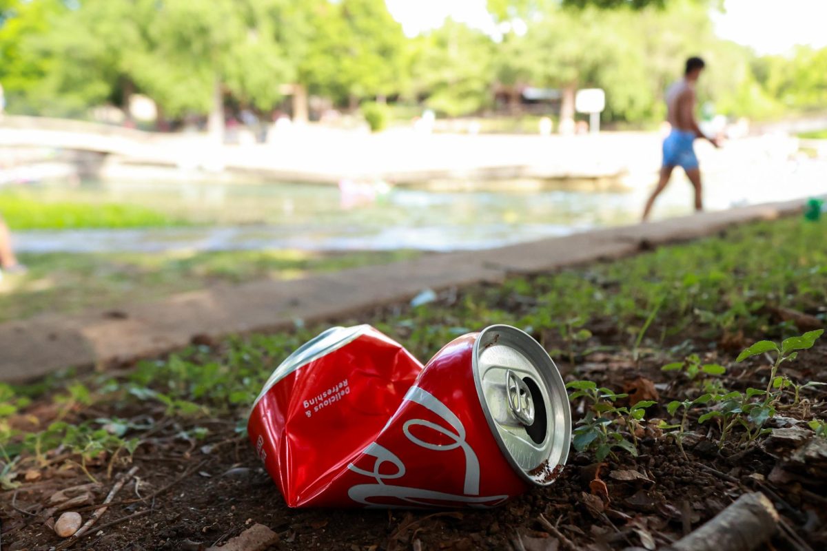 Crushed can left in the grass, Thursday, July 4, 2024, at Sewell Park.