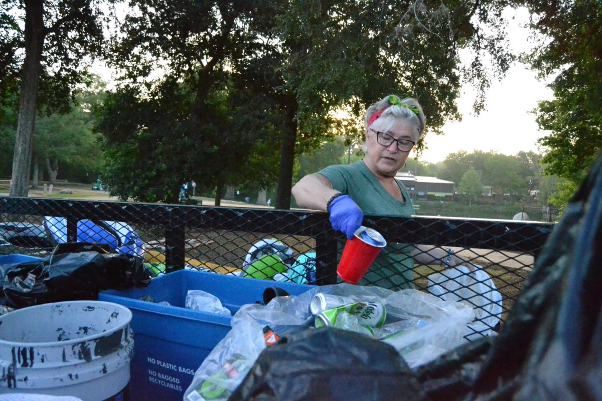 Volunteer Mary OHara separates trash, Sunday, July 7, 2024, at Rio Vista Park.