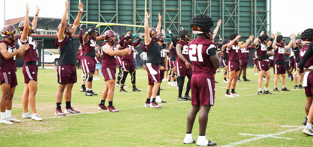 The Texas State football team warms up together before the first day of fall practices, Wednesday, July 31, 2024, at the Texas State practice field.