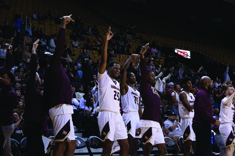 The Texas State men's basketball team celebrate a three pointer during the game against Troy, Friday, March. 1, 2024, at Strahan Arena.