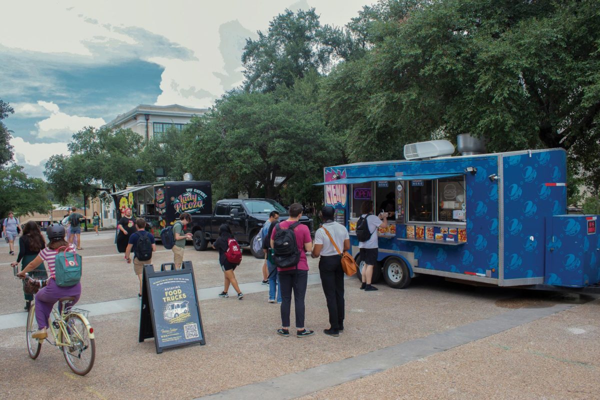 Students gather by Lady Picoza and Bombass Burgers rotating food trucks, Monday, Aug. 26, 2024, by Flowers Hall on Bobcat Trail.