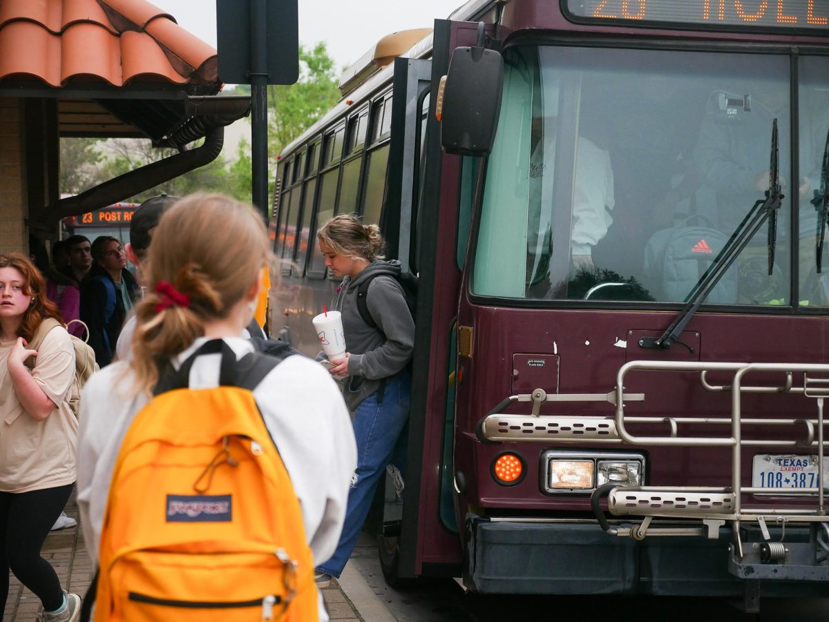 Student gets off Holland route Bobcat Shuttle March 24, 2024 at the Quad bus stop. 