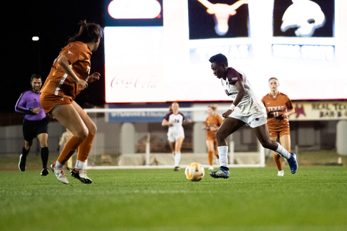 Texas State freshman midfielder Helen Alormenu dribbles the ball during the match against Texas, Friday, March 1. 2024, at Mike A. Myers Stadium in Austin. 