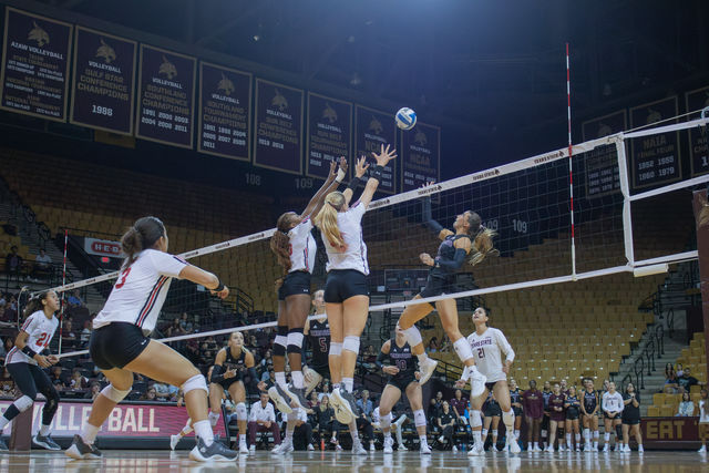 Junior outside hitter Maggie Walsh (2) leaps above the net to hit the ball during the game versus Lamar, Saturday, Aug. 24, 2024, at Strahan Arena. 