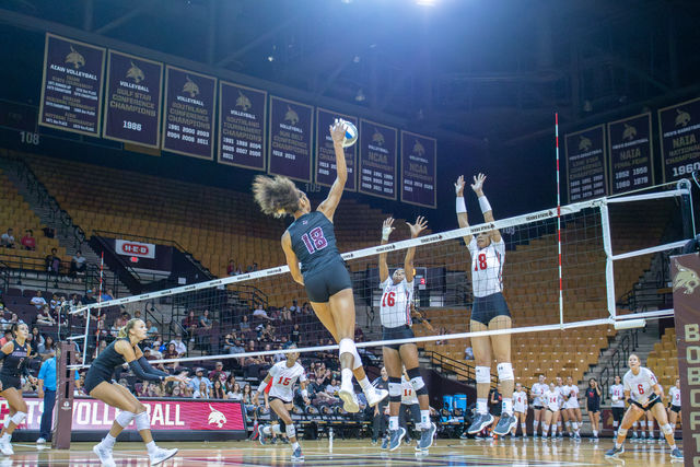 Redshirt freshman middle blocker Zenai Jethroe (18) spikes the ball over the net during the game versus Lamar, Saturday, Aug. 24, 2024, at Strahan Arena.