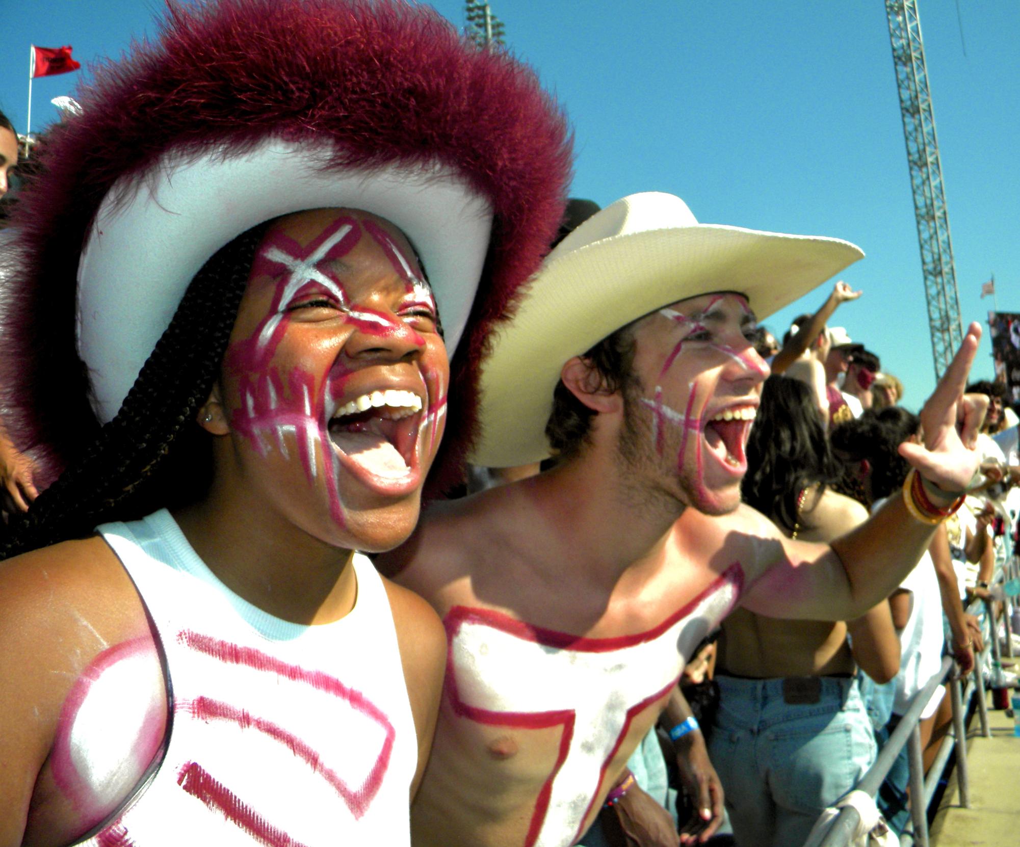 Hellcats pledges Kendyl White (Left) and Kyle Moore (Right) cheer on the Bobcats, Saturday, Sept. 7, 2024 at UFCU Stadium.