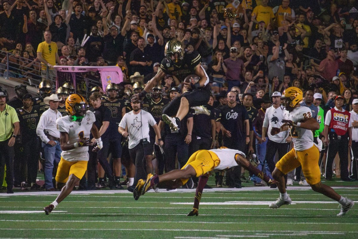 Texas State senior wide receiver Joey Hobert (10) hurdles over an Arizona State defender, Thursday, Sept. 12, 2024, at Jim Wacker Field at UFCU Stadium.