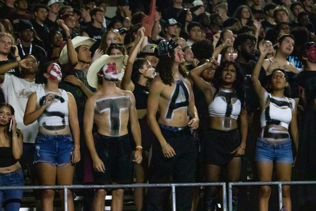 Members of Texas State's spirit fraternity Hellcats cheer on the football team as the play Arizona State, Thursday, Sept. 12, 2024, at UFCU Stadium.