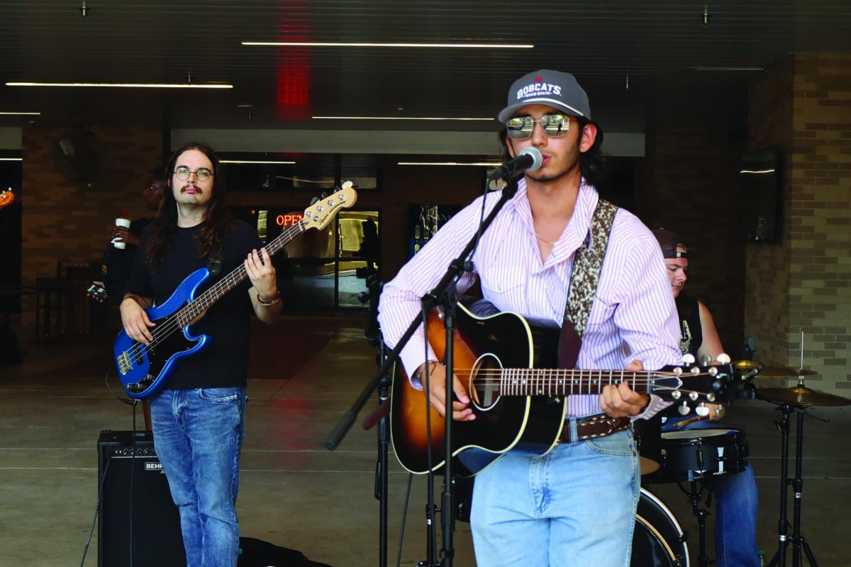 Bo Moore and his band perform cover songs at the Tunes at Noon event on campus, Tuesday, Sept. 10, 2024, at the LBJ Amphitheater.