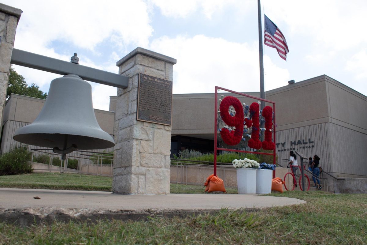 The U.S. flag is raised in honor of the 23rd anniversary of the 9/11 attacks alongside a rose commemoration, Wednesday, Sept. 11, 2024, outside City Hall.