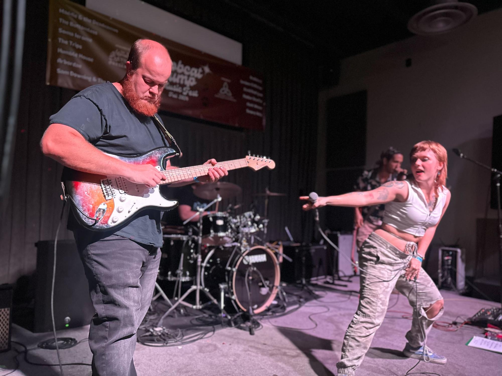 Tyler Watts (Left) shreds the guitar with his band, The Bottomless, for students during the Bobcat Jump music festival, Thursday, Sept. 19, 2024, at Railyard Bar and Grill.