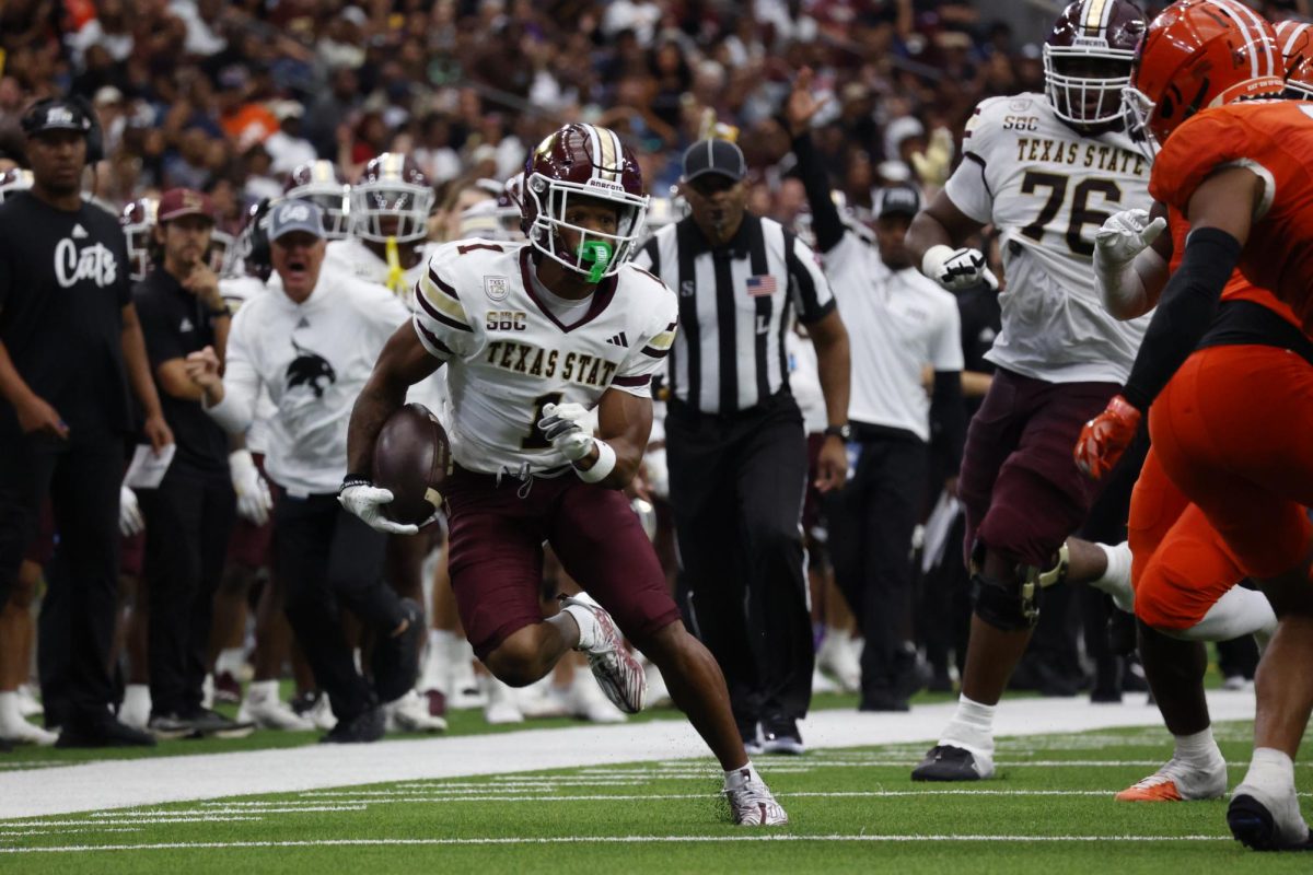 Texas State redshirt junior cornerback Josh Eaton (1) runs the ball down the sideline during the Bobcats' first game against Sam Houston State University since 2011 at NRG Stadium in Houston, Texas Sept. 28, 2024.