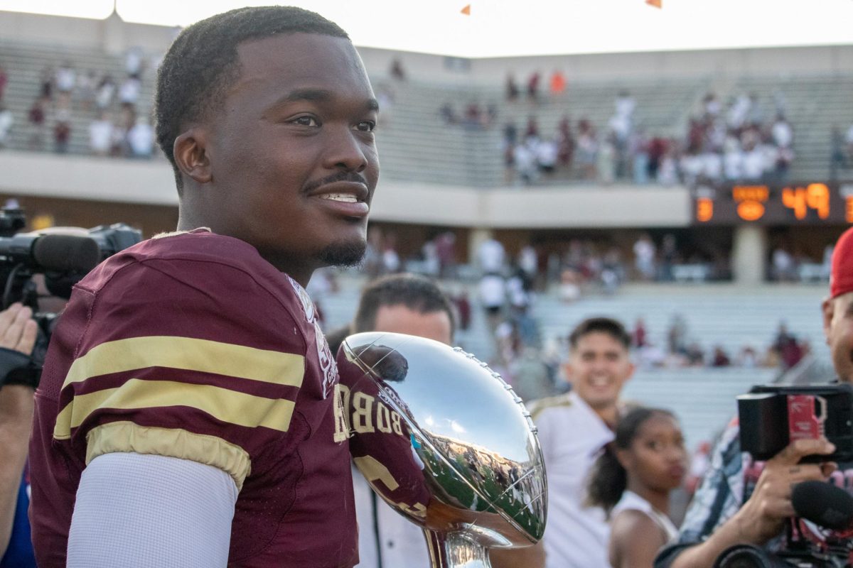 Texas State redshirt senior quarterback Jordan McCloud (3) brings the I-35 Showdown trophy onto the field after defeating UTSA, Saturday, Sept. 7, 2024, at Jim Wacker Field at UFCU Stadium.