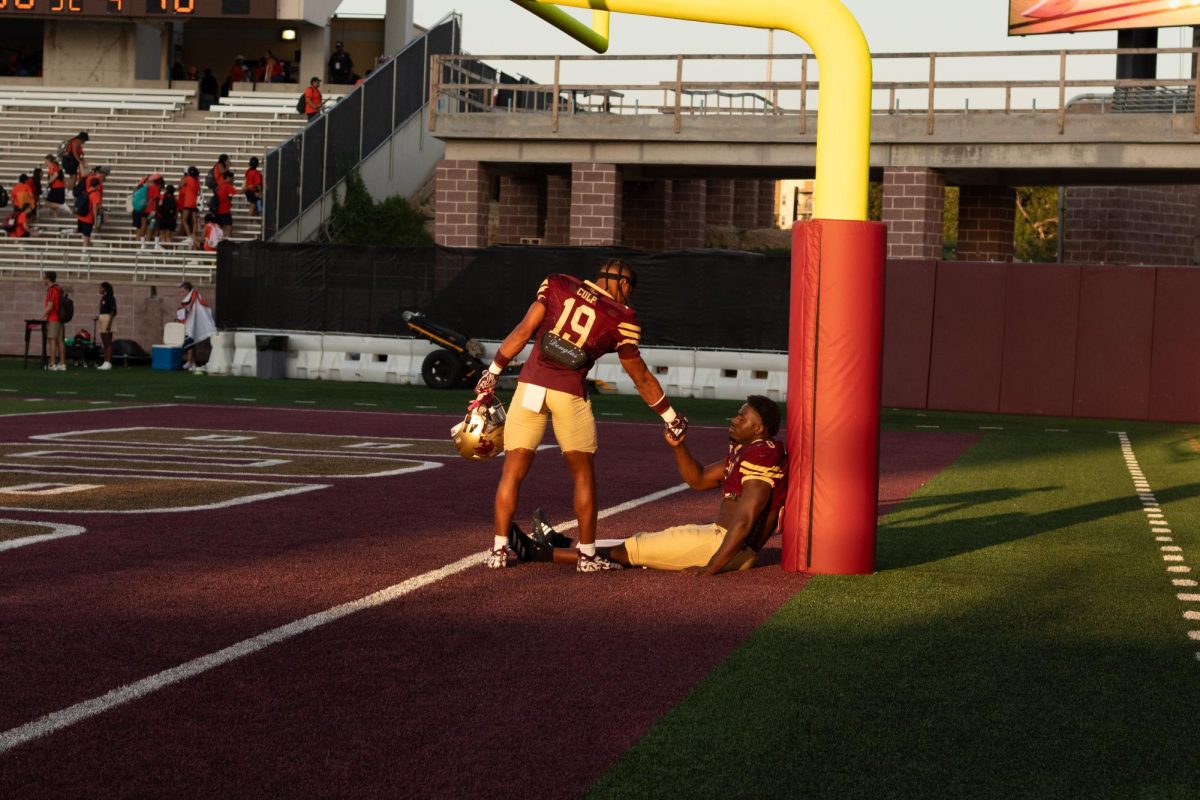 Texas State senior safety Kaleb "Kuga" Culp (19) (left) and redshirt senior defensive end Steven Parker (0) come together after defeating UTSA, Saturday, Sept. 7, 2024, at UFCU Stadium.