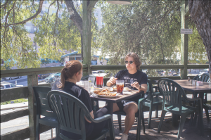 Texas State alumni Derek Russell (Right) enjoys his favorite food, chicken fried chicken, alongside marketing senior Emma Allen (Left), who enjoys her favorite, chicken fried steak, Sunday, Sept. 8, 2024, at Grins Restaurant.