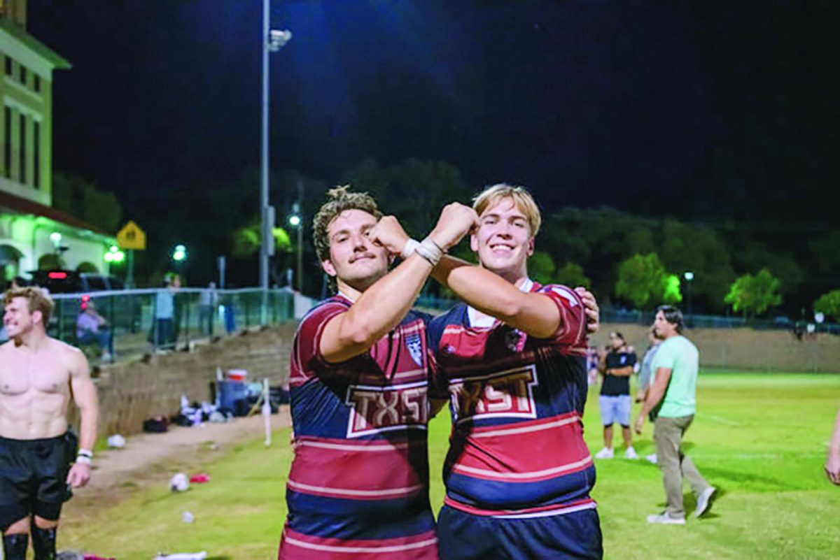 Texas State Rugby members William Turner (Left) and Kyle Tucker  (Right)celebrate their victory over UTSA, Friday, Sept. 27, 2024, at the West Campus Soccer Fields.