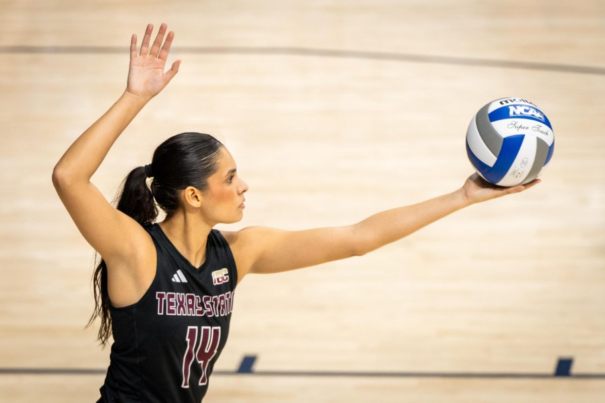 Texas State fifth-year senior setter Ryann Torres (14) prepares to serve the ball during the match against Houston Christian at the Rice Invitational, Friday, Aug. 30, 2024, at Tudor Fieldhouse in Houston.  