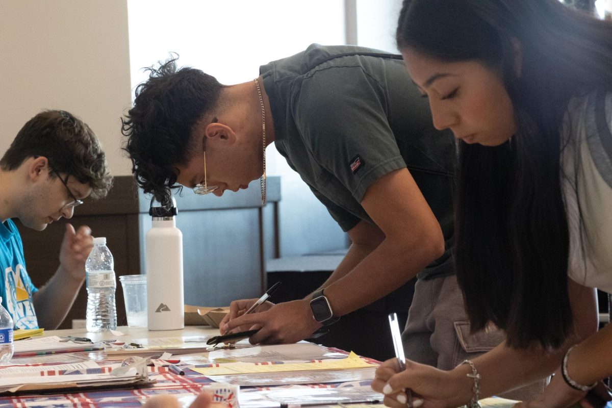 Texas State junior accounting major Sebastian Perez Diaz registers to vote during the Hispanic-Serving Institution Community Day event, Monday, Sept. 10, 2024 in LBJ Ballroom.




