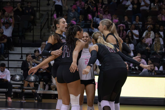 The Texas State volleyball team huddles together after a successful rally against Arkansas State. Friday, Oct. 18, 2024, at Strahan Arena.